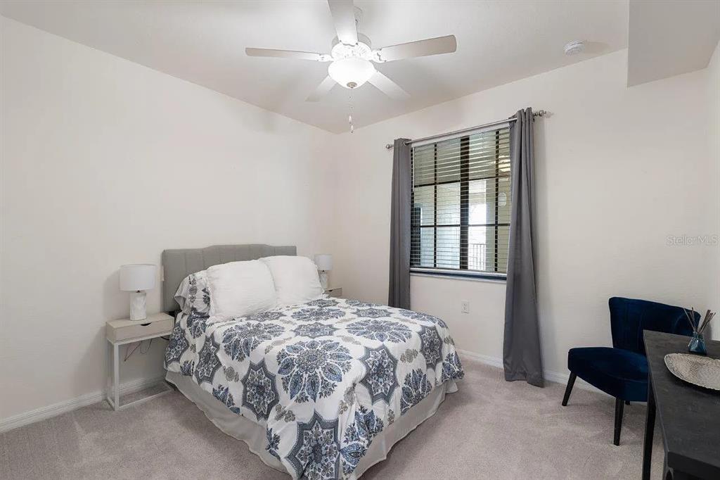 17724 Gawthrop Drive, Unit 204 Bradenton, FL 34211 - Photo 20 of 55 a bedroom with a bed and a window
