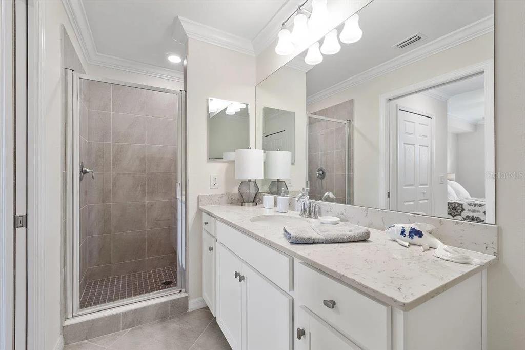 17724 Gawthrop Drive, Unit 204 Bradenton, FL 34211 - Photo 29 of 55 a bathroom with a sink double vanity and a shower