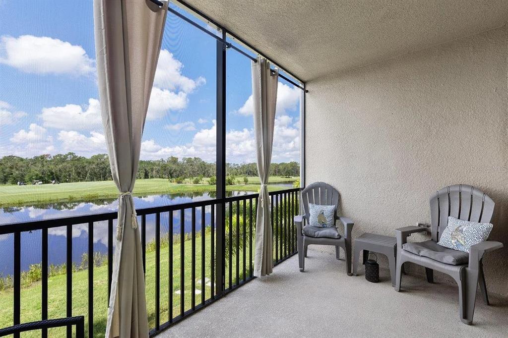 17724 Gawthrop Drive, Unit 204 Bradenton, FL 34211 - Photo 32 of 55 a view of a two chair and table in the balcony