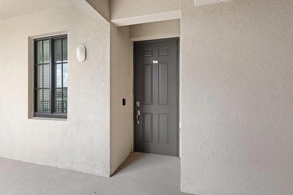 17724 Gawthrop Drive, Unit 204 Bradenton, FL 34211 - Photo 35 of 55 an empty room with windows and closet