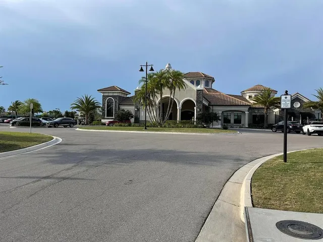 an aerial view of a house with a yard basket ball court and outdoor seating