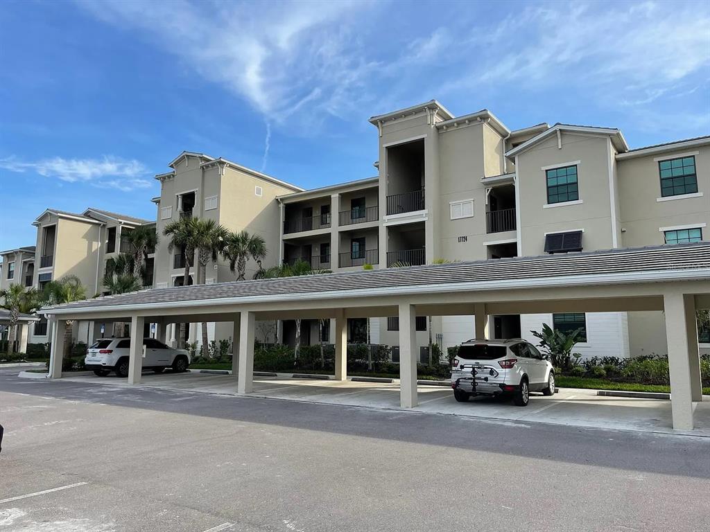 17724 Gawthrop Drive, Unit 204 Bradenton, FL 34211 - Photo 49 of 55 a front view of building with cars parked
