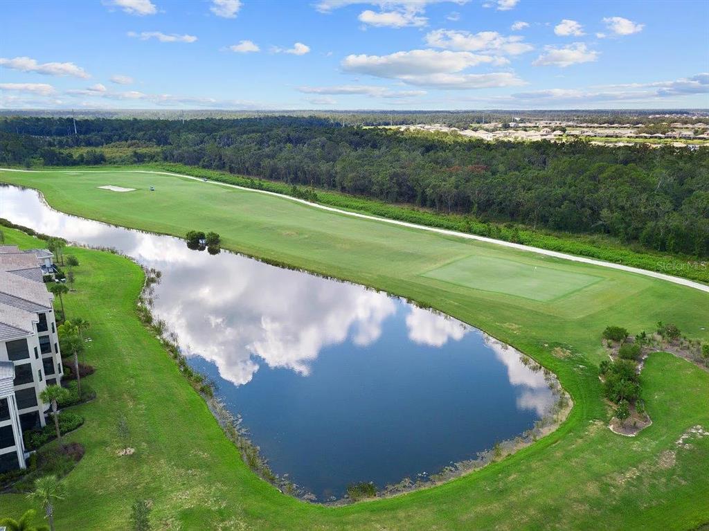 17724 Gawthrop Drive, Unit 204 Bradenton, FL 34211 - Photo 50 of 55 a view of a golf course with a garden