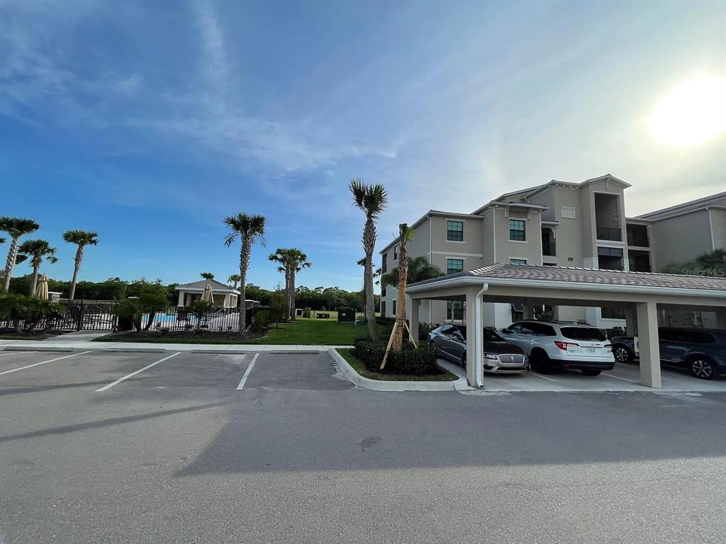 17724 Gawthrop Drive, Unit 204 Bradenton, FL 34211 - Photo 51 of 55 a view of a street with cars on road