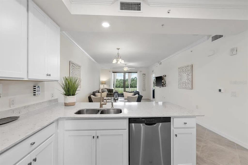 17724 Gawthrop Drive, Unit 204 Bradenton, FL 34211 - Photo 10 of 55 a kitchen with sink and window