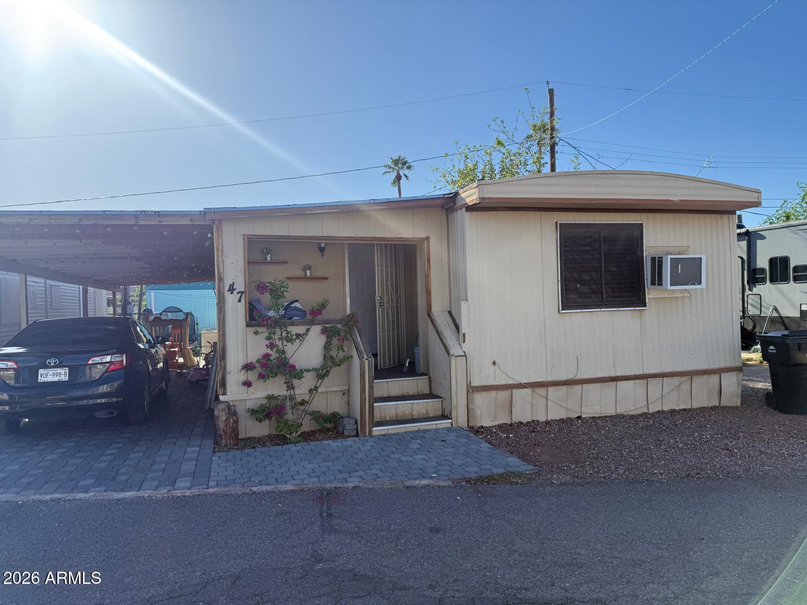 130 East McKellips Road, Unit 47 Mesa, AZ 85201 - Photo 1 of 6 a view of a garage