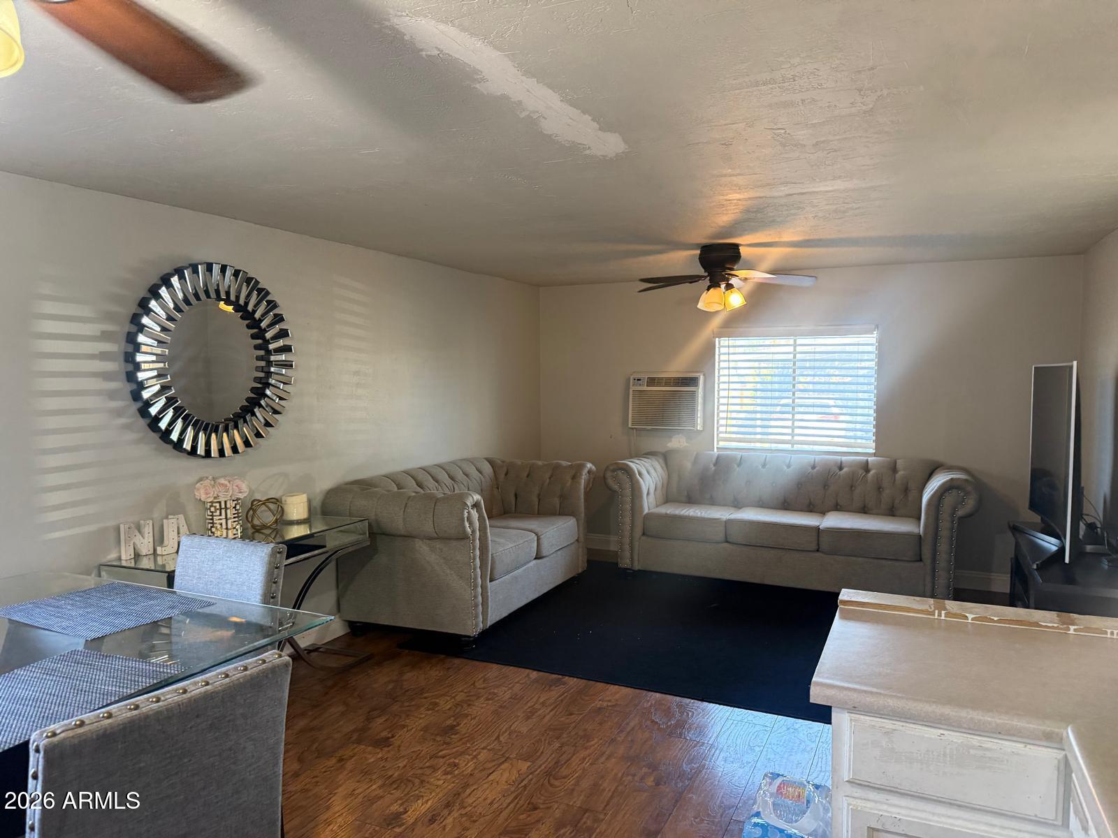 130 East McKellips Road, Unit 47 Mesa, AZ 85201 - Photo 5 of 6 a living room with furniture and a large window
