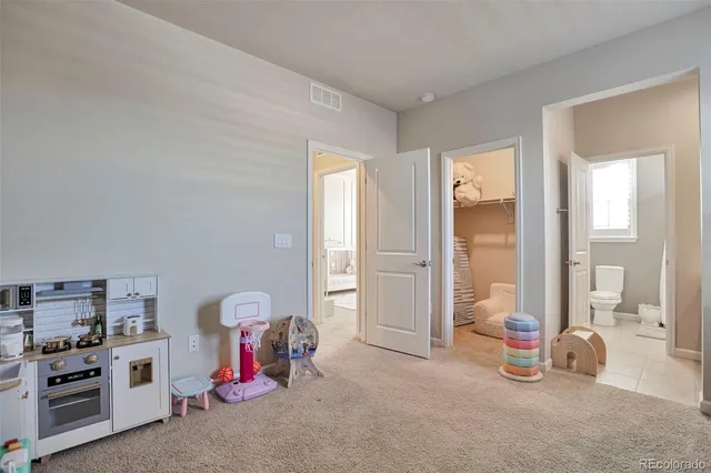 a room with toys and a view of bedroom