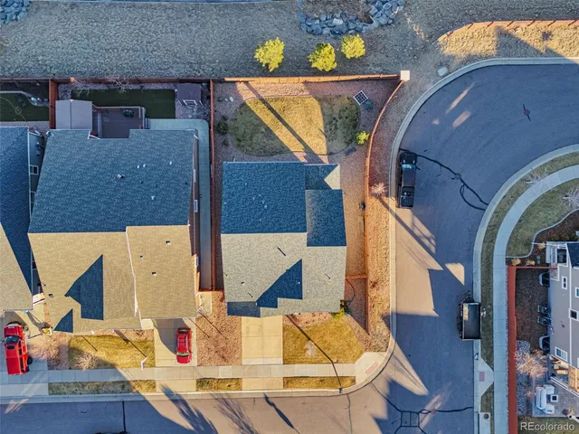 an aerial view of residential houses with wooden floor