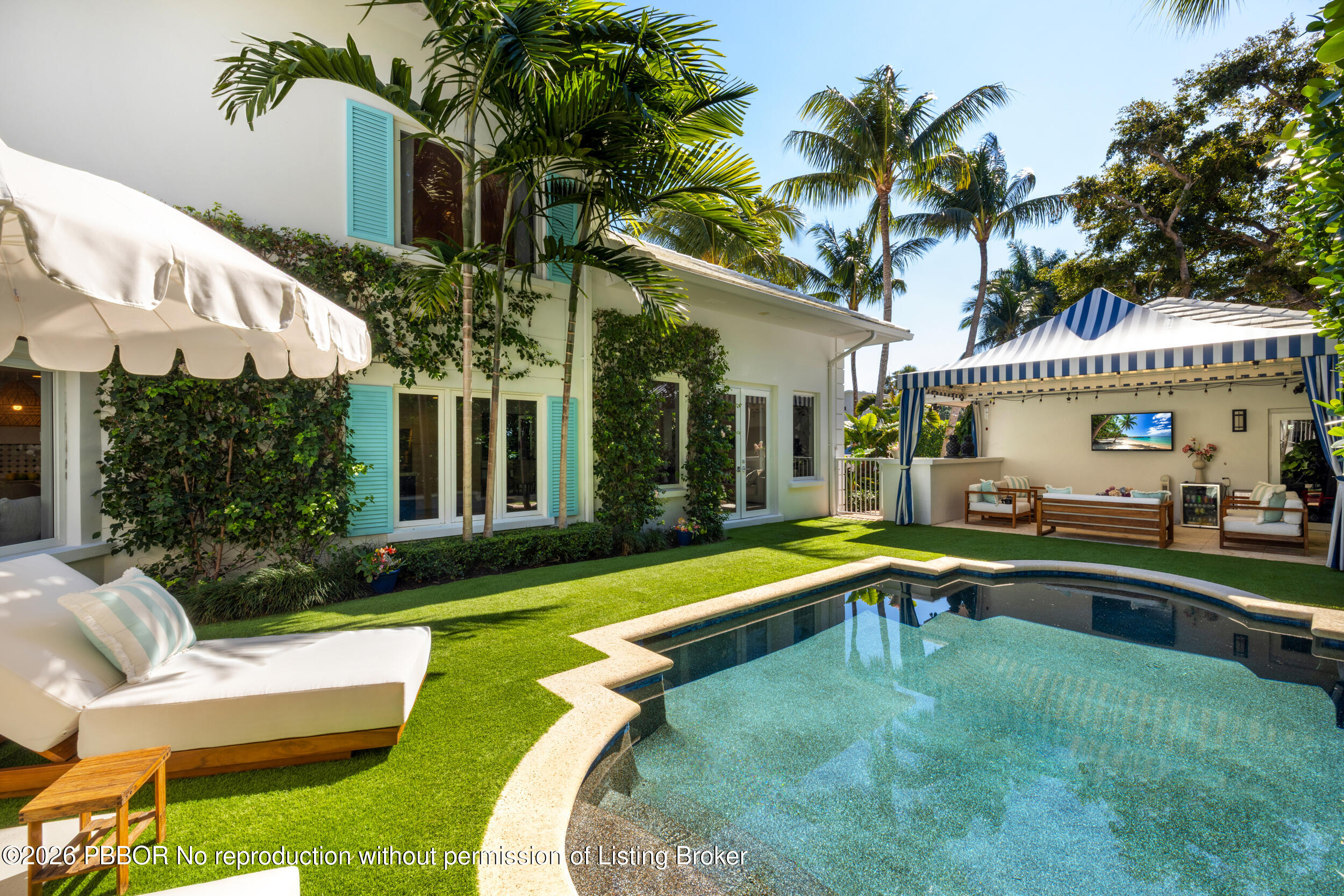 121 Seville Road West Palm Beach, FL 33405 - Photo 1 of 67 a view of a house with swimming pool and sitting area