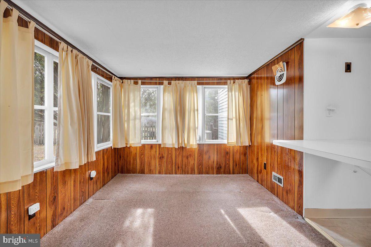 263 Hopkins Road Haddonfield, NJ 08033 - Photo 12 of 38 a view of an entryway with wooden floor and windows
