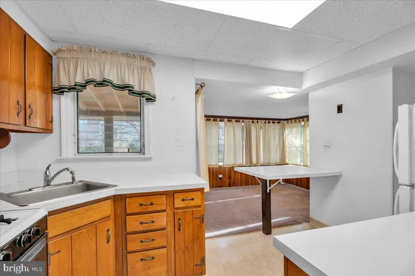 a view of a hallway with seating area
