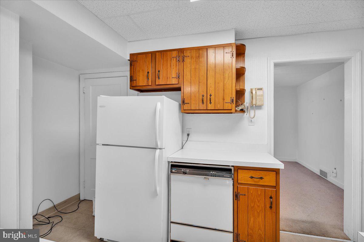 263 Hopkins Road Haddonfield, NJ 08033 - Photo 17 of 38 a white refrigerator freezer sitting in a kitchen
