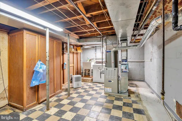 a room with a chair and cabinets