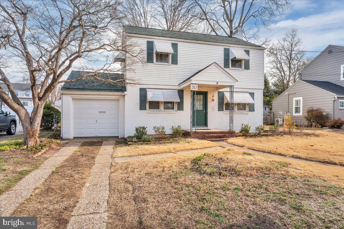 263 Hopkins Road Haddonfield, NJ 08033 - Photo 3 of 38 a view of a white house with a yard covered in snow