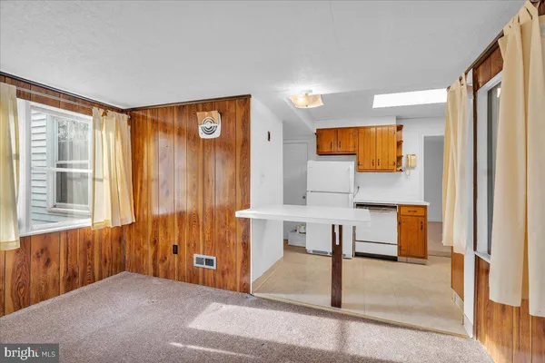 a view of kitchen with furniture and large window