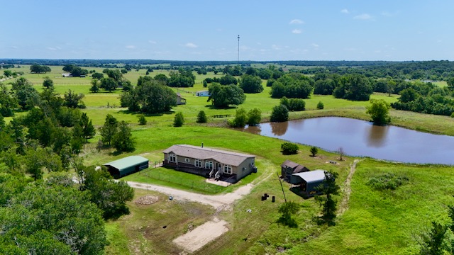 8655 Templeton Road Hearne, TX 77859 - Photo 1 of 1 Aerial view of sparsely populated area featuring a large body of water