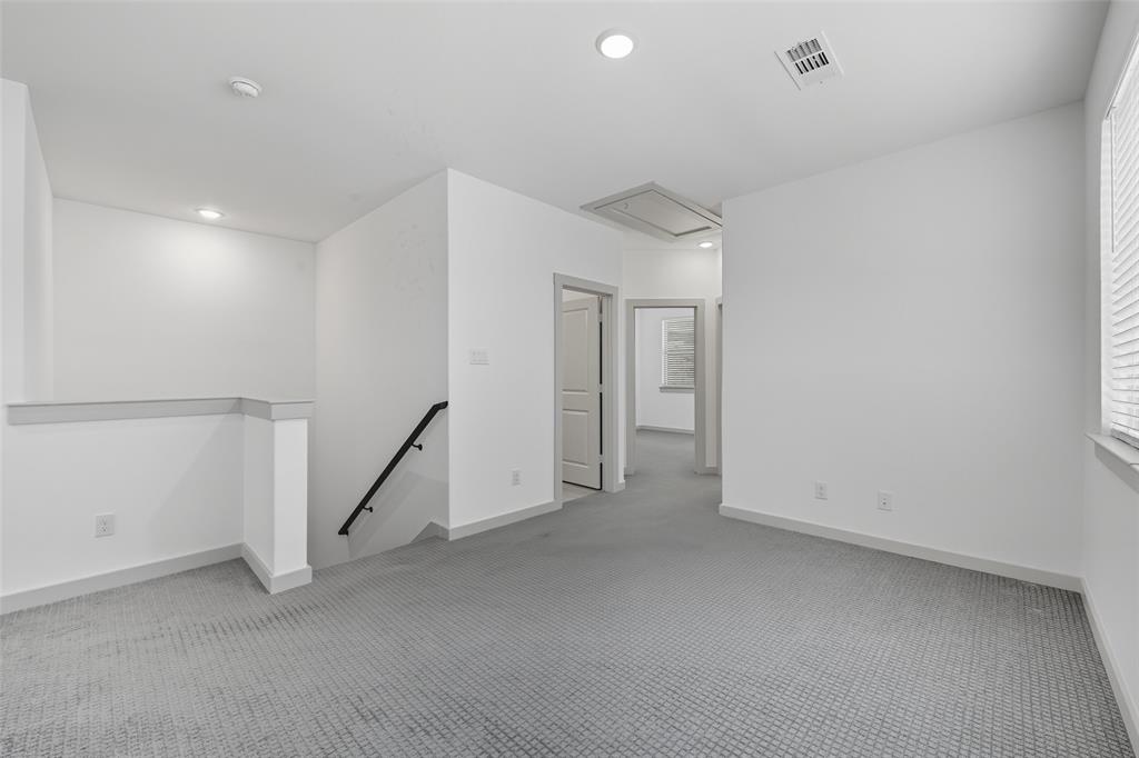 228 Spring Hill Road Flower Mound, TX 75028 - Photo 16 of 31 a view of an empty room