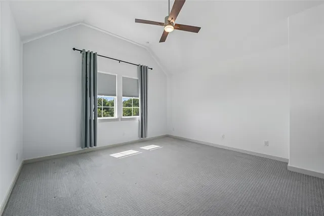 a bedroom with a bed furniture and a window