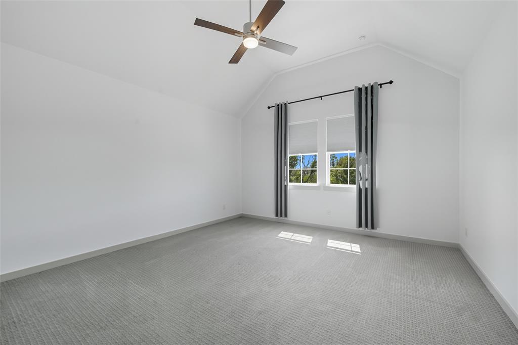 228 Spring Hill Road Flower Mound, TX 75028 - Photo 19 of 31 an empty room with a window and a ceiling fan