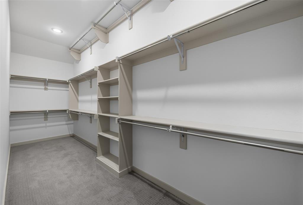 228 Spring Hill Road Flower Mound, TX 75028 - Photo 21 of 31 a view of an empty walk in closet
