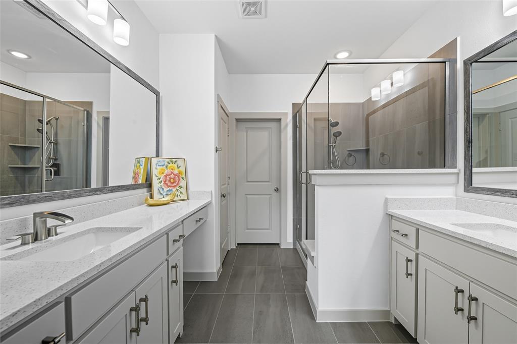 228 Spring Hill Road Flower Mound, TX 75028 - Photo 22 of 31 a spacious bathroom with a sink and a mirror