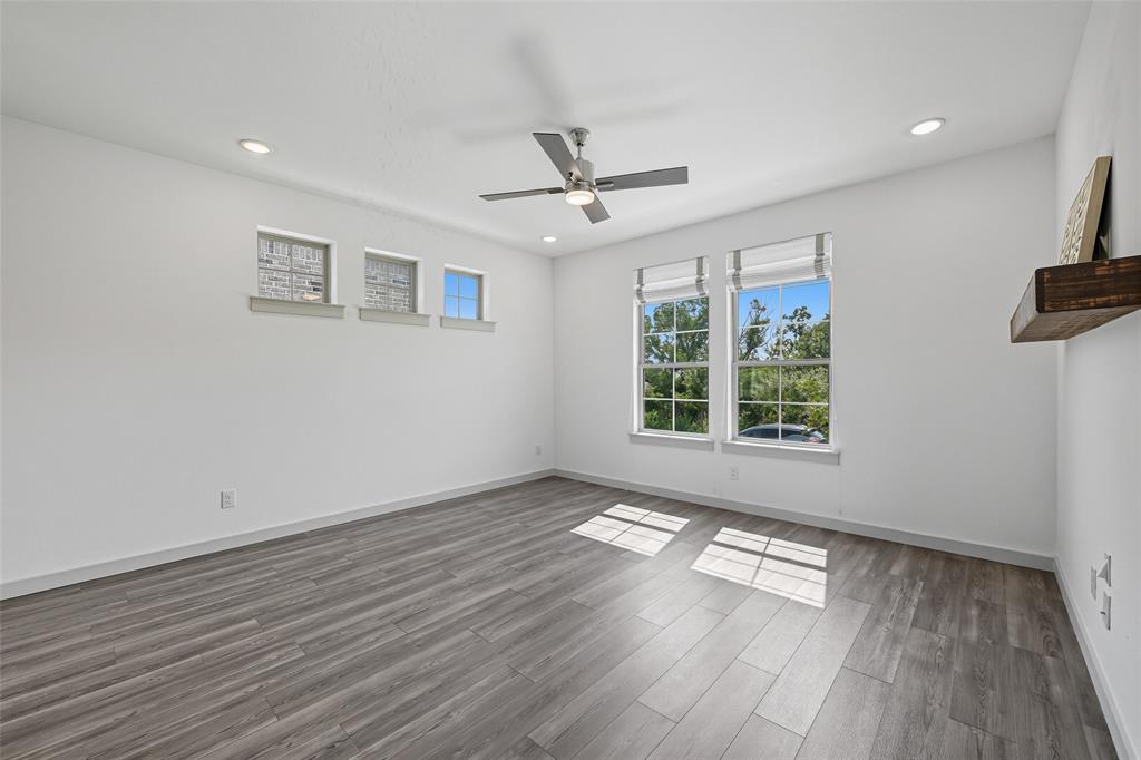 228 Spring Hill Road Flower Mound, TX 75028 - Photo 8 of 31 wooden floor in an empty room with a window