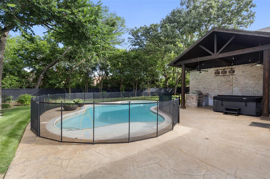 609 Seville Road Denton, TX 76205 - Photo 7 of 40 In-Ground Gunite pool with removable fence (shown), cover (not shown) - approx 5.5ft deep, 20k gallons.