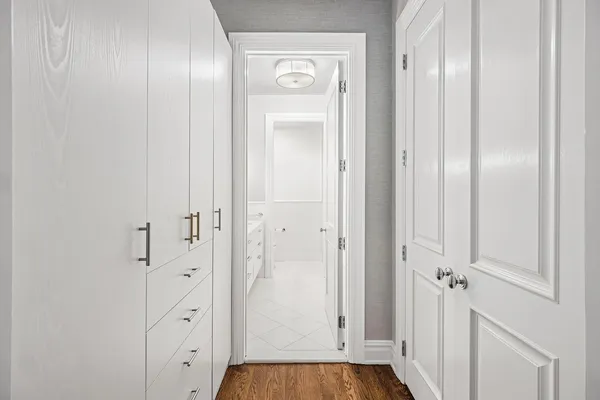 a spacious bedroom with a bed and a fireplace