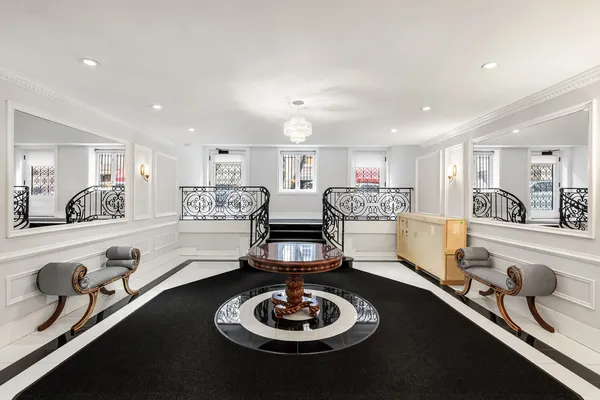 a bathroom with a sink mirror and toilet