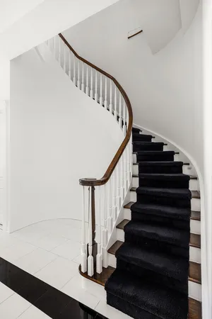 a kitchen with stainless steel appliances a sink stove and cabinets