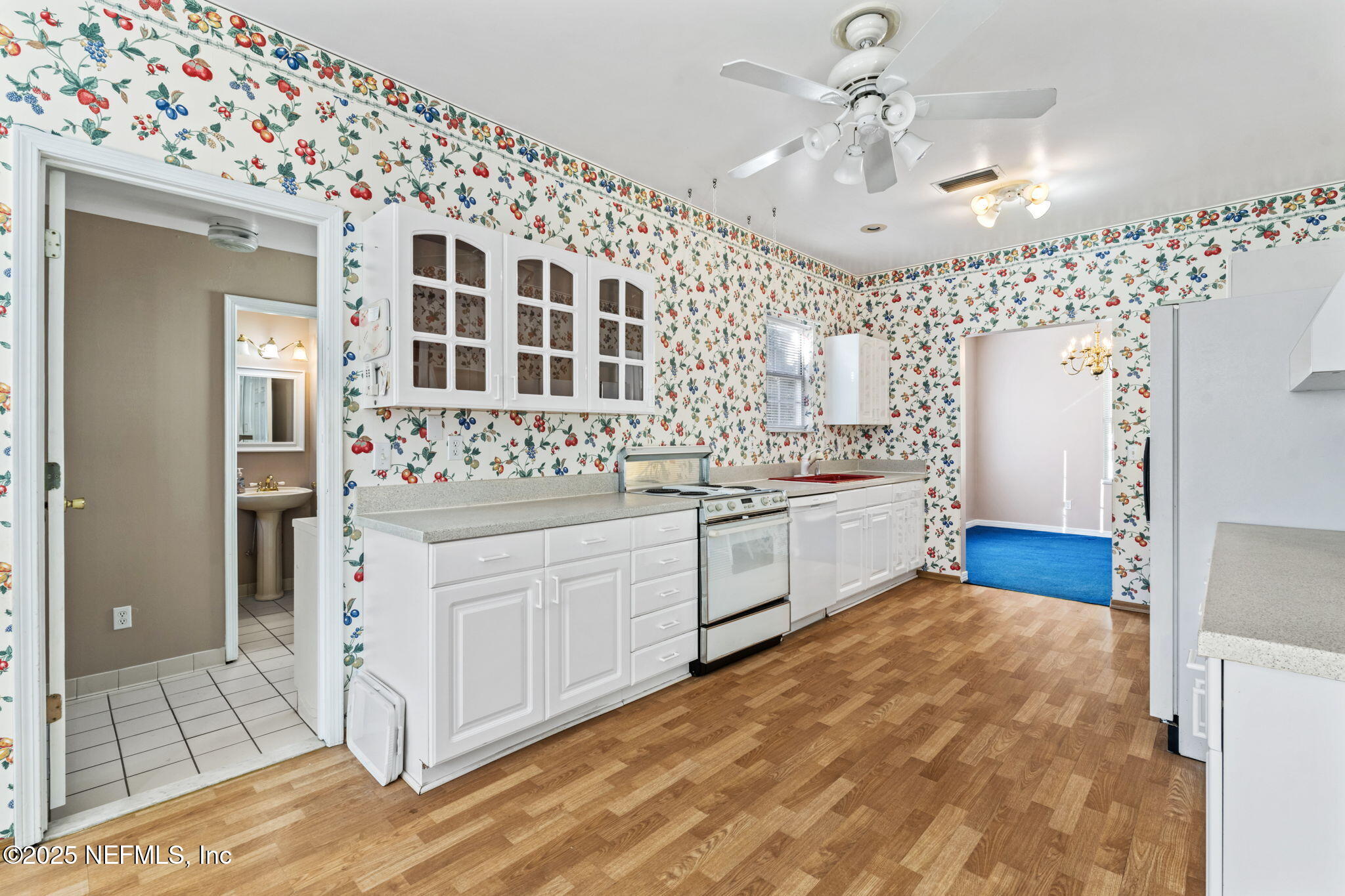 8705 River Park Road St. Augustine, FL 32092 - Photo 27 of 57 a kitchen with stainless steel appliances a sink and a refrigerator