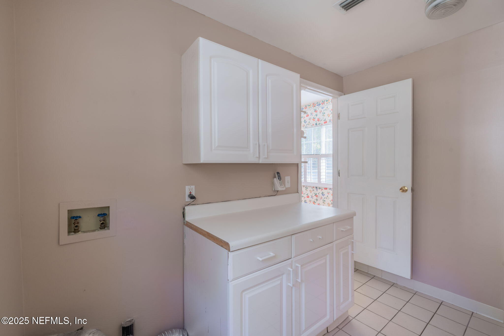 8705 River Park Road St. Augustine, FL 32092 - Photo 29 of 57 a kitchen with a sink cabinets and a window
