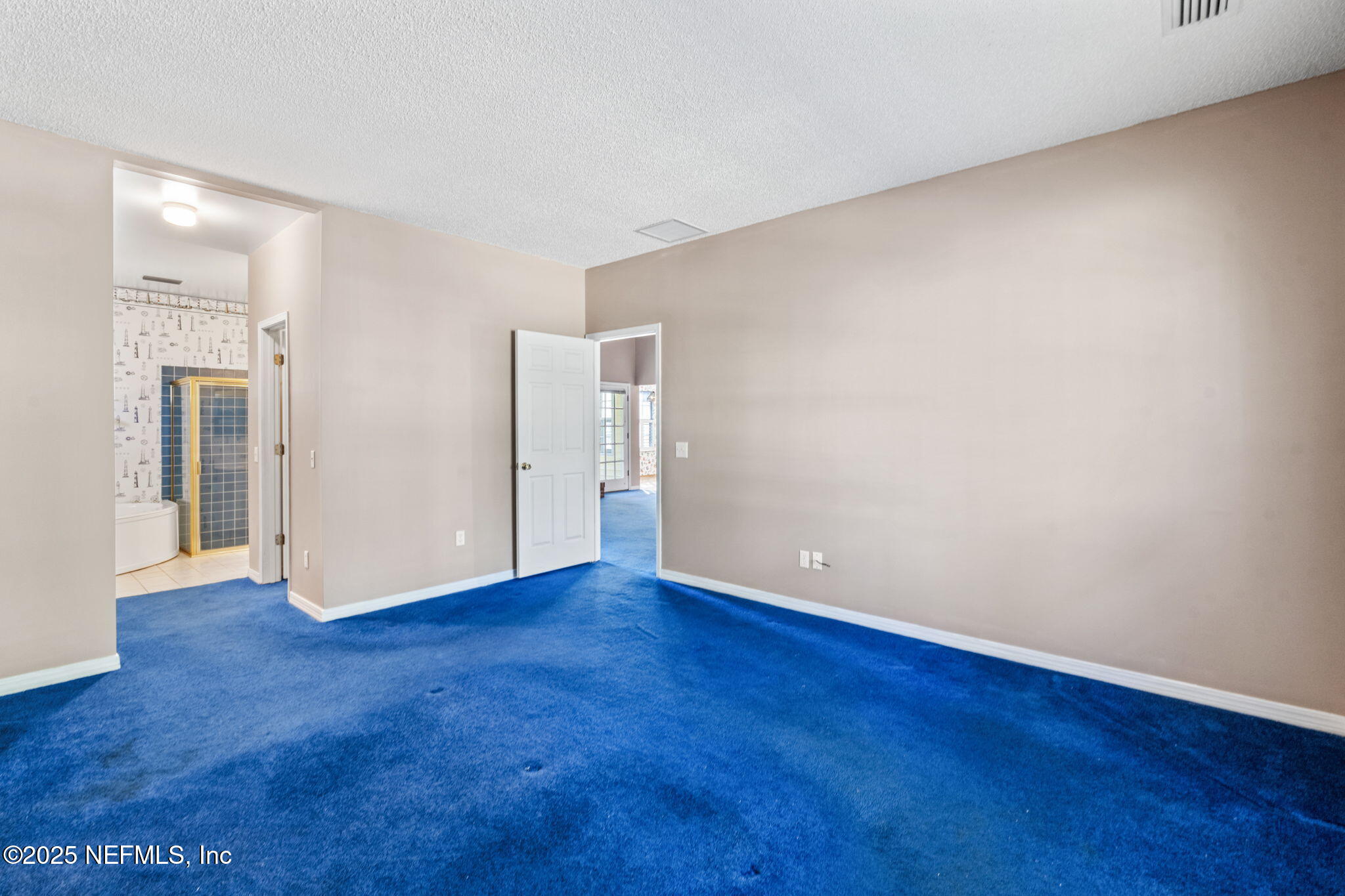 8705 River Park Road St. Augustine, FL 32092 - Photo 32 of 57 a view of an empty room with wooden floor and a window