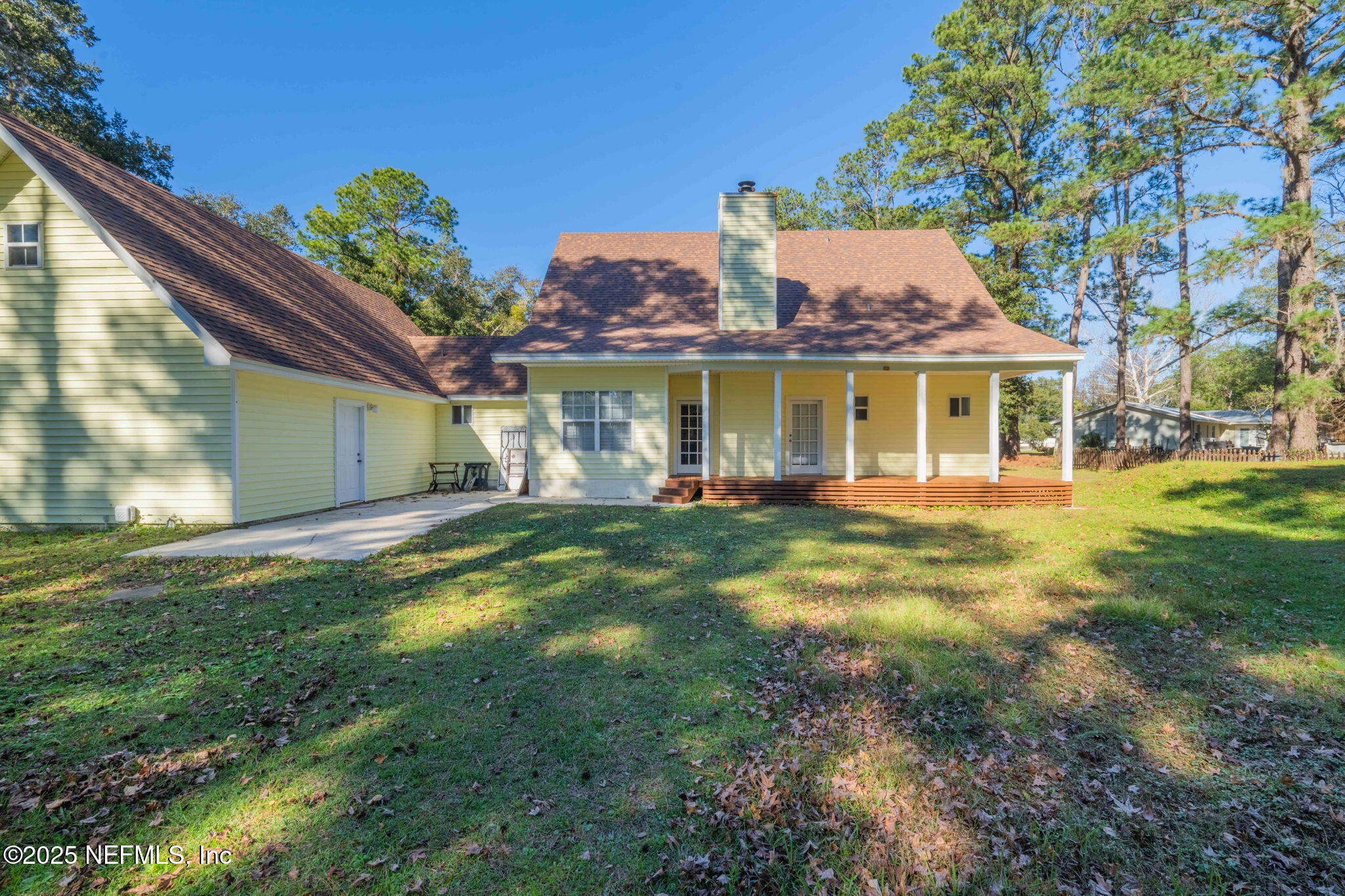 8705 River Park Road St. Augustine, FL 32092 - Photo 47 of 57 a view of a house with a big yard potted plants and large tree