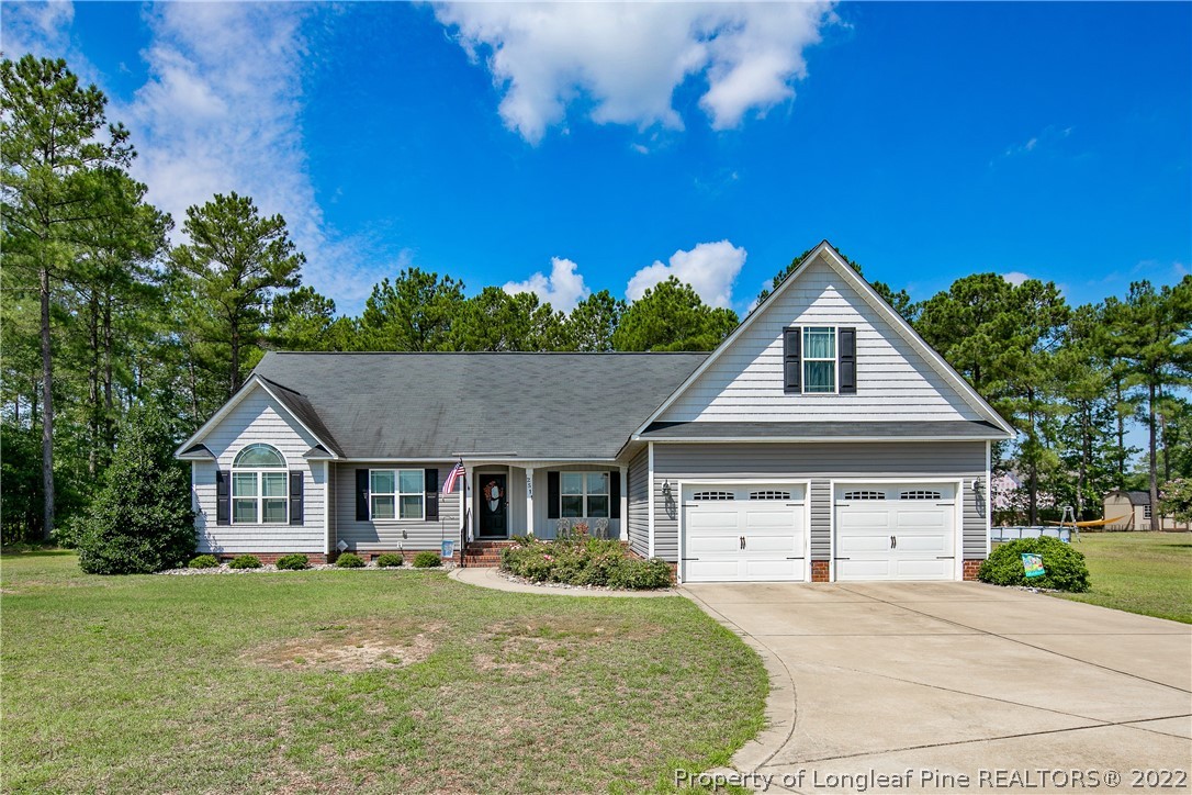 2511 Wade-Stedman Road Stedman, NC 28391 - Photo 1 of 47 a front view of a house with yard and green space