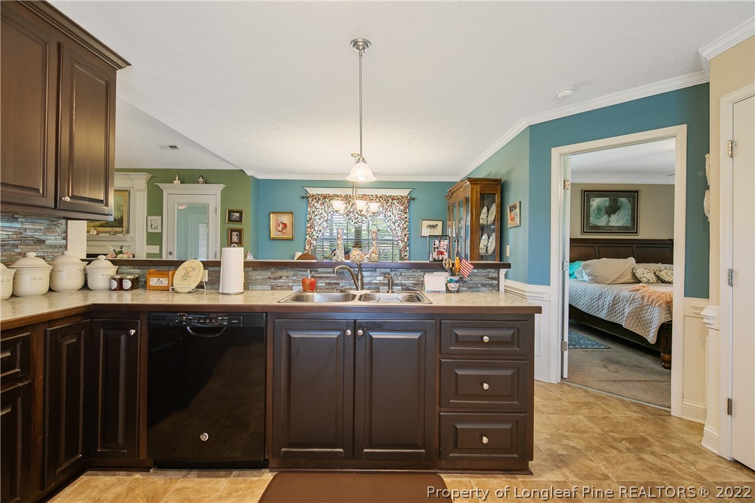 2511 Wade-Stedman Road Stedman, NC 28391 - Photo 15 of 47 a kitchen with a sink and cabinets