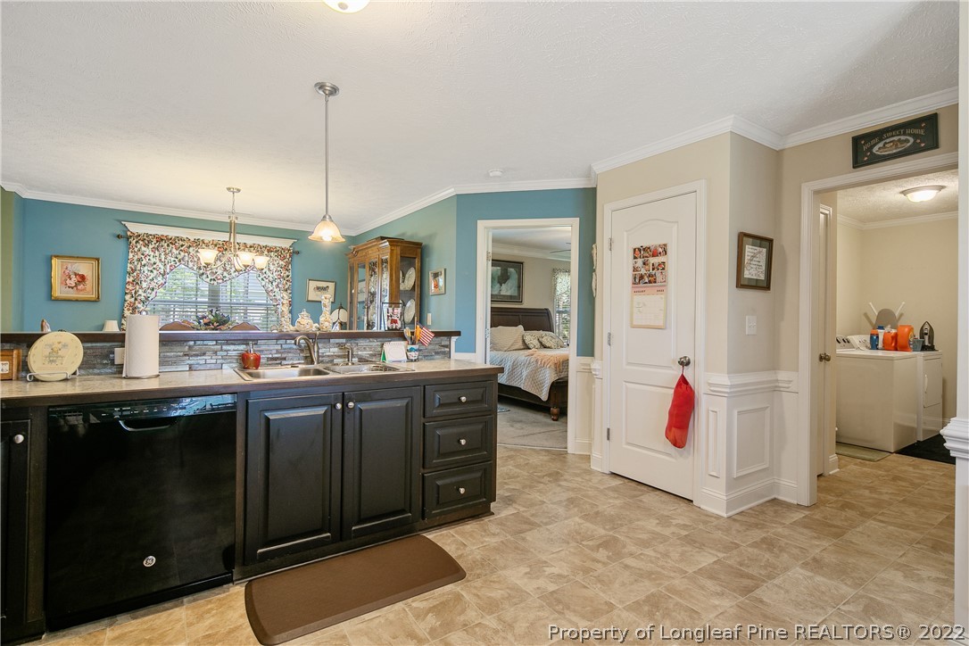 2511 Wade-Stedman Road Stedman, NC 28391 - Photo 16 of 47 a kitchen with cabinets and appliances