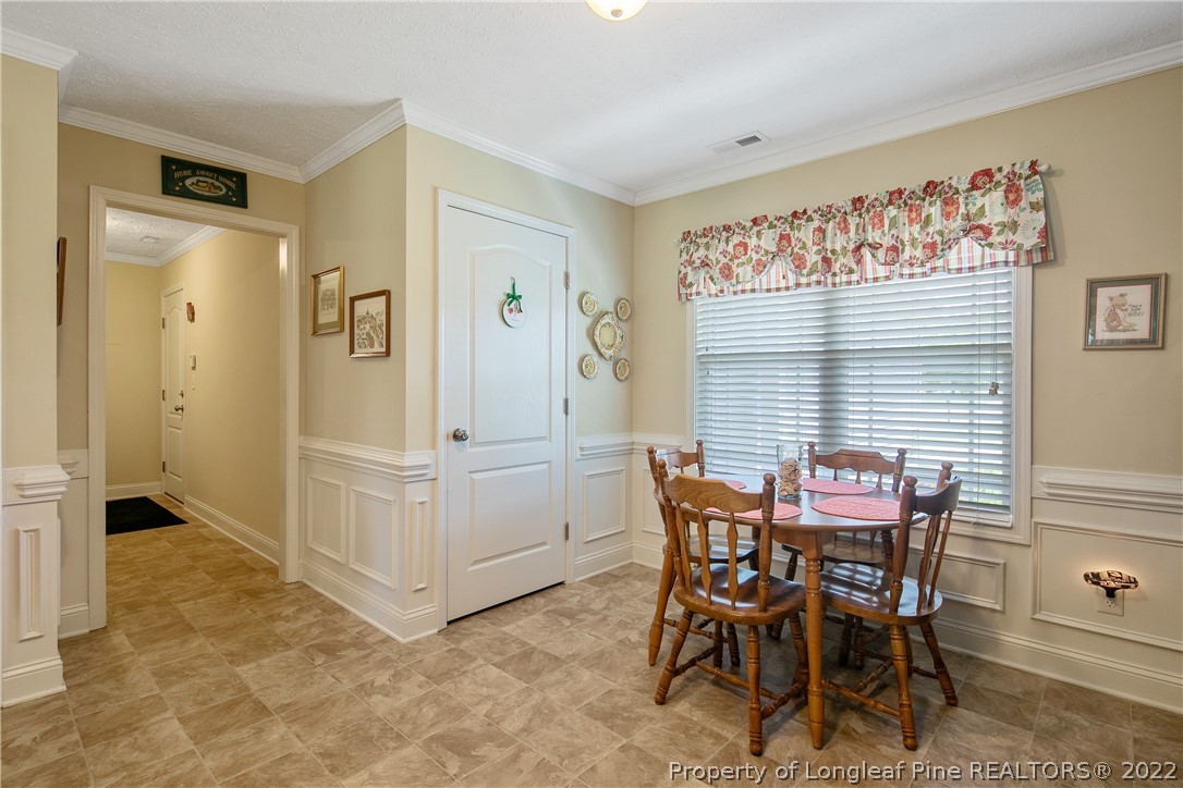 2511 Wade-Stedman Road Stedman, NC 28391 - Photo 17 of 47 a view of a dining room with furniture and a window