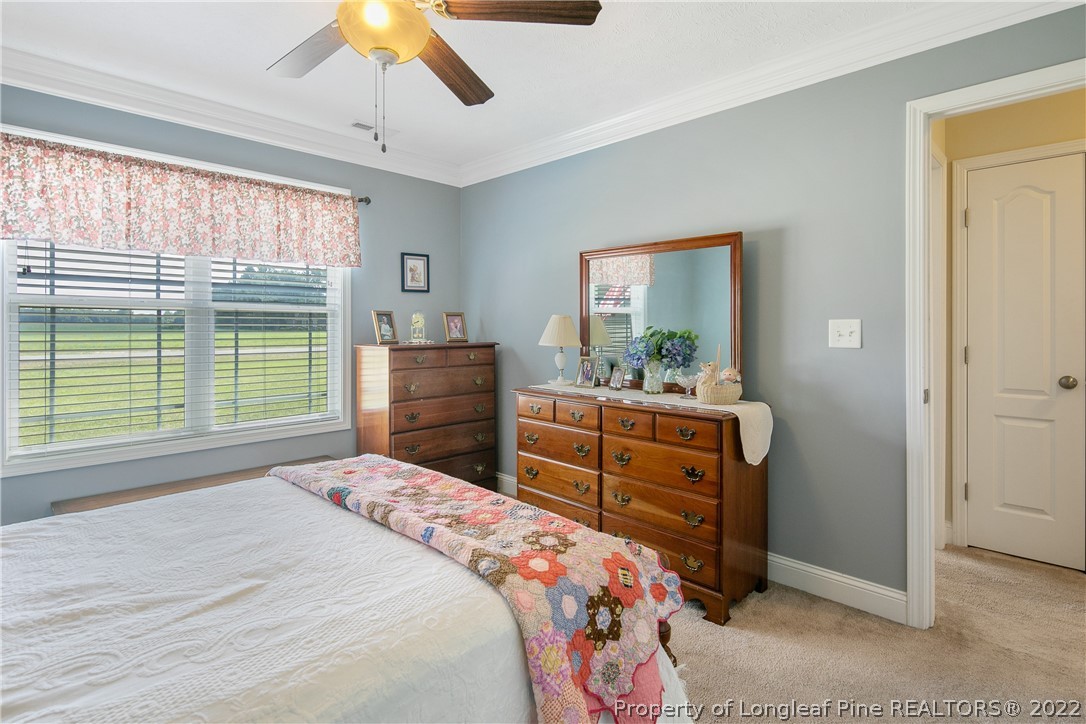 2511 Wade-Stedman Road Stedman, NC 28391 - Photo 28 of 47 a bedroom with a bed and a dresser