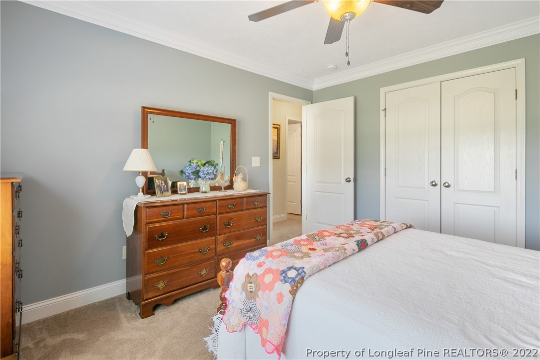 2511 Wade-Stedman Road Stedman, NC 28391 - Photo 29 of 47 a bedroom with a bed and a dresser