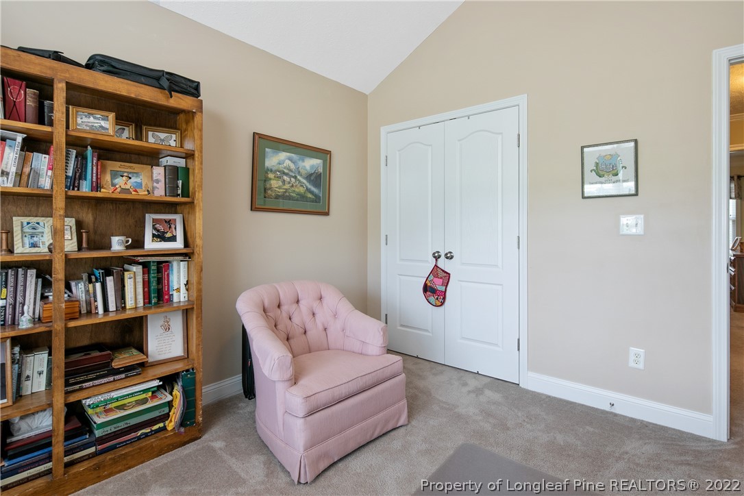 2511 Wade-Stedman Road Stedman, NC 28391 - Photo 32 of 47 a living room with furniture cabinets and a book shelf