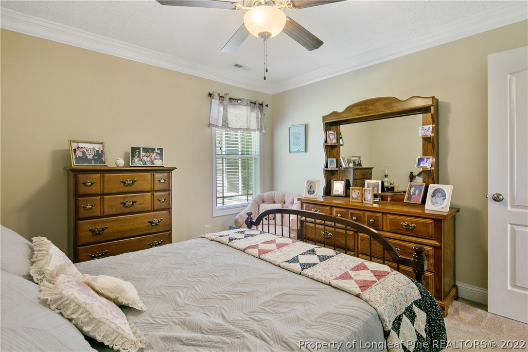 2511 Wade-Stedman Road Stedman, NC 28391 - Photo 36 of 47 a bedroom with a bed and a dresser