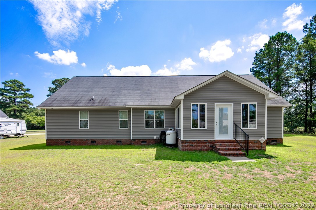 2511 Wade-Stedman Road Stedman, NC 28391 - Photo 45 of 47 a front view of a house with a garden