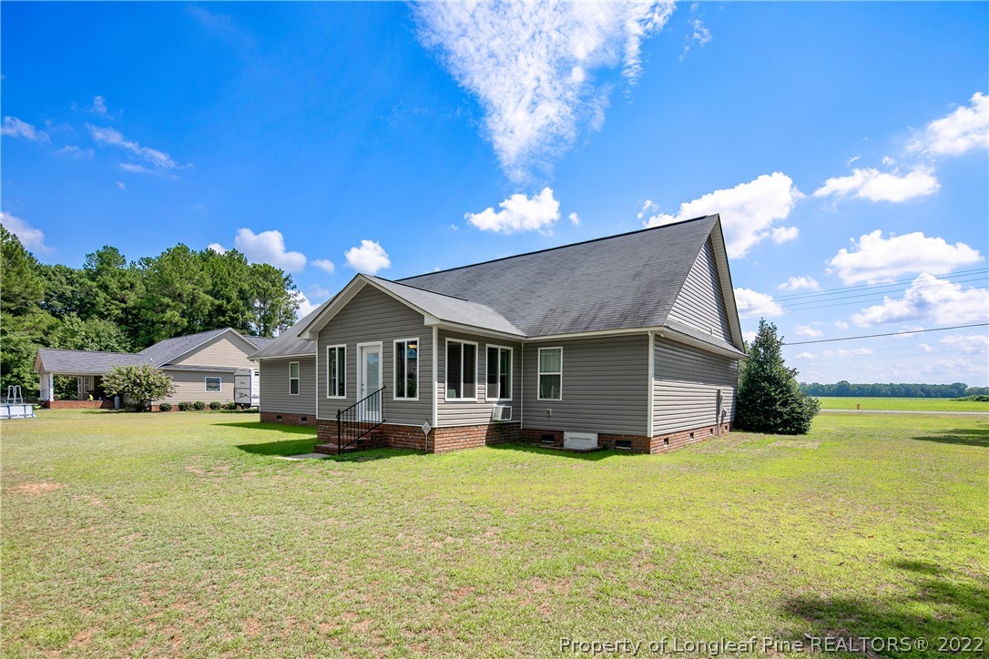 2511 Wade-Stedman Road Stedman, NC 28391 - Photo 47 of 47 a front view of a house with a yard