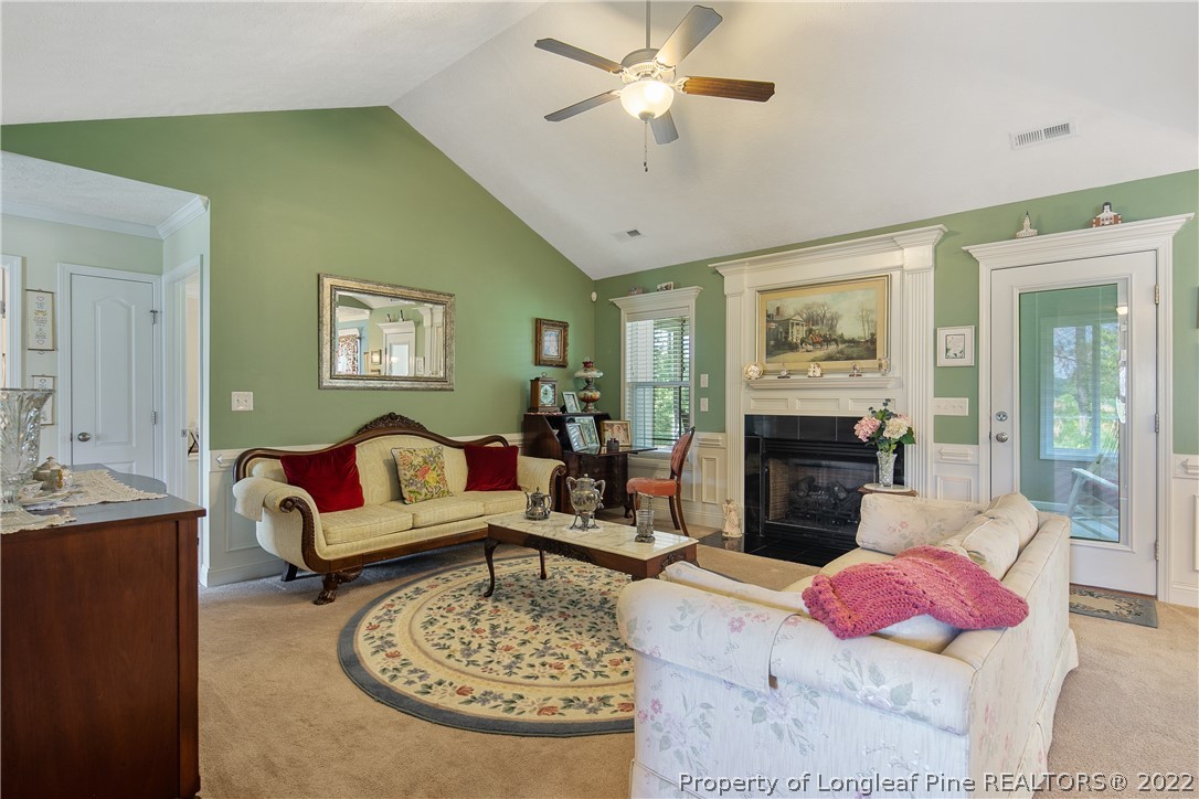 2511 Wade-Stedman Road Stedman, NC 28391 - Photo 6 of 47 a living room with furniture and a fireplace