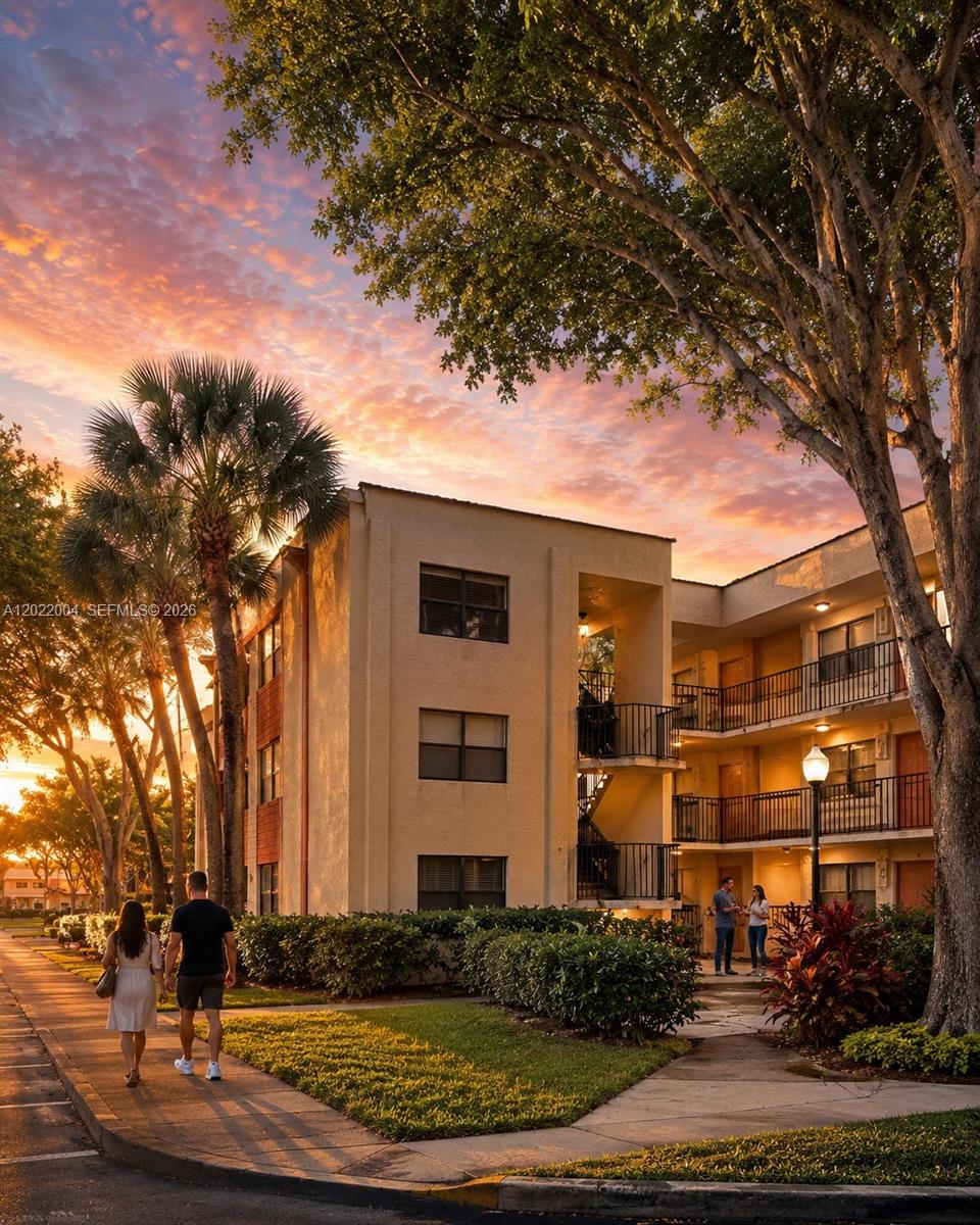 3400 Foxcroft Road, Unit 301 Miramar, FL 33025 - Photo 2 of 72 front view of house with a street