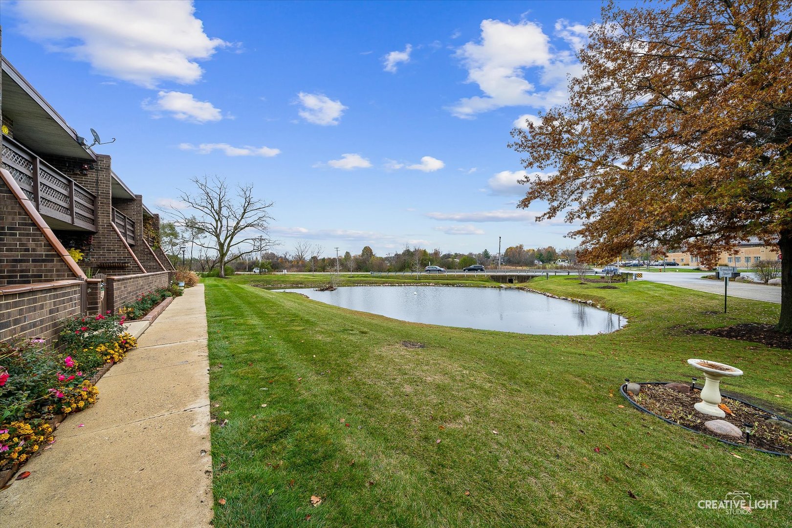 1807 Kenneth Circle Elgin, IL 60120 - Photo 2 of 16 a view of a swimming pool with lawn chairs and a big yard