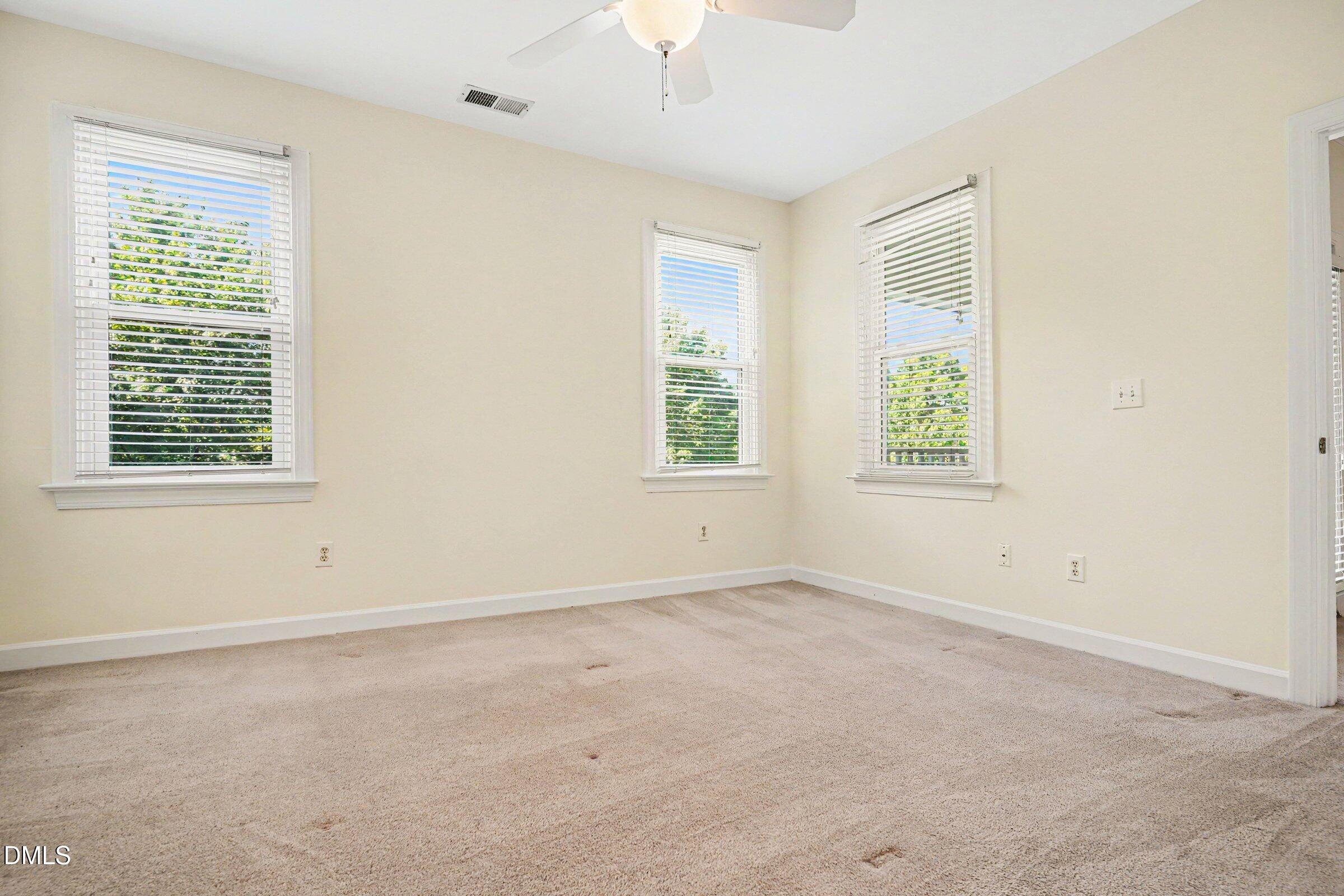 2651 Mellowfield Drive, Unit 203 Raleigh, NC 27604 - Photo 10 of 32 an empty room with windows