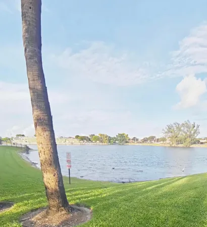 a view of a field with ocean view